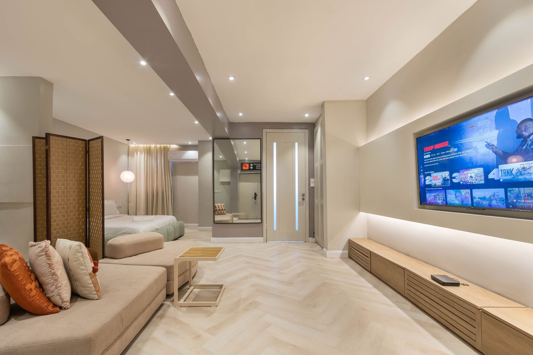 Lounge at The District Lekki with layered lighting and gallery walls